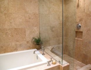 Travertine tile shower with a luxurious Zuma tub.