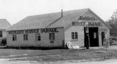 Albert Siebler's Service Garage in Loup City, Nebraska. Circa 1935